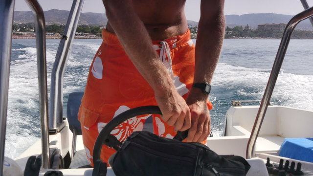 skipper on a boat in the sea 