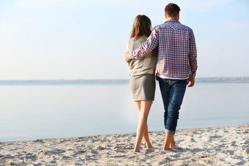 Young couple on the riverside