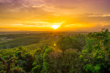 hillside meadow in high mountain in warm sunset light