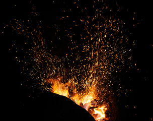 The flame sparks from a forge