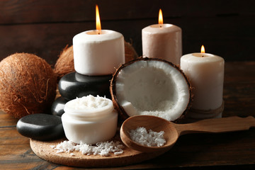 Spa coconut products on dark wooden background