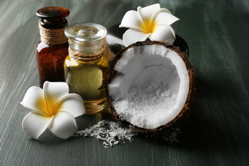 Spa coconut products on dark wooden background