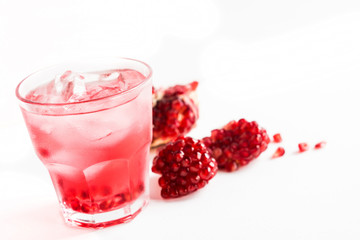 Delicious pomegranate cocktail on the wooden background