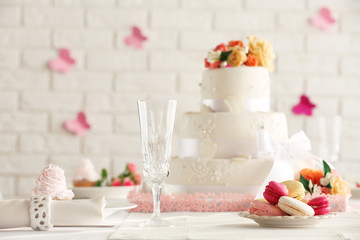 Beautiful decorated table for wedding on white wall background