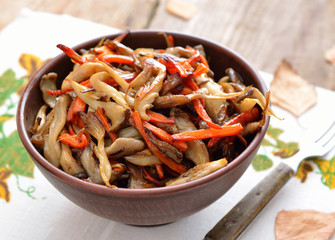 Fried oyster mushroom on a frying pan.