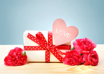 Love message with gift box and carnations