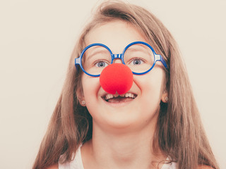 Little girl with red nose