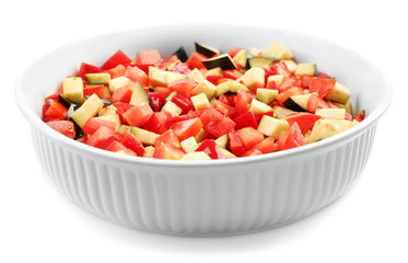 Ratatouille, stewed vegetable dish with tomatoes, zucchini, eggplant before cooking, isolated on white