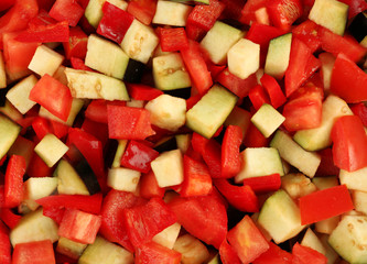 Ratatouille, stewed vegetable dish with tomatoes, zucchini, eggplant before cooking, macro view