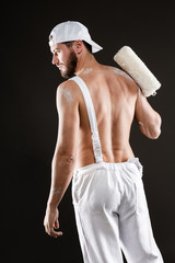 attractive young painter with paint roller © guerrieroale