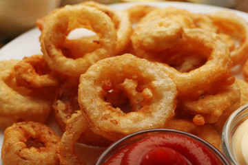 Chips rings with sauce on plate