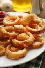 Chips rings with sauce on plate