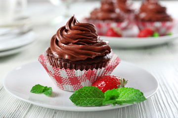 Chocolate cupcakes on plate closeup