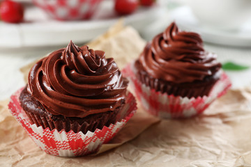 Chocolate cupcakes on craftpaper closeup