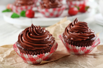 Chocolate cupcakes on craftpaper closeup