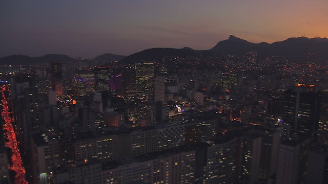 Flying above Downtown buildings of Rio de Janeiro at Sunset, Brazil