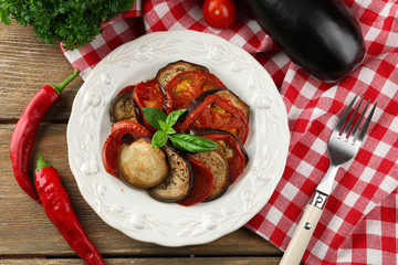Ratatouille on plate, on table background