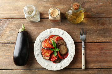 Ratatouille on plate, on table background