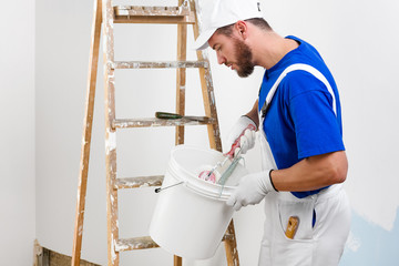 painter in white dungarees, blue t-shirt © guerrieroale
