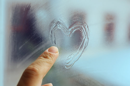 Heart Drawn On The Fogged Glass Window