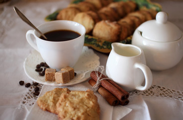Cup of coffee and oatmeal cookies.
