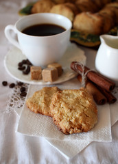 Cup of coffee and oatmeal cookies.