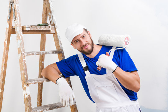 painter in white dungarees, blue t-shirt