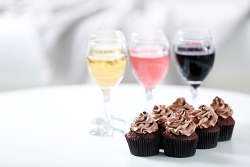 Tasting of wine and chocolate cupcakes, close up