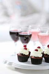 Tasting of wine and chocolate cupcakes, close up