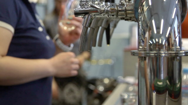 Barman pulling a pint of beer