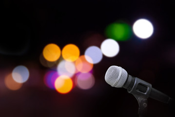 Fototapeta na wymiar Microphone on stage background 