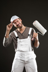 Attractive bearded young painter with paint roller © guerrieroale