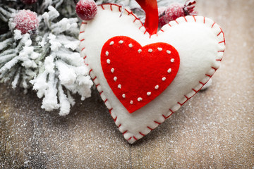 Christmas decoration with fir branches on the wood background.