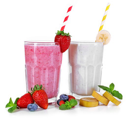 Glasses of fresh cold smoothie and fruit, isolated on white