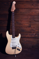 Obraz premium Electric guitar on wooden background