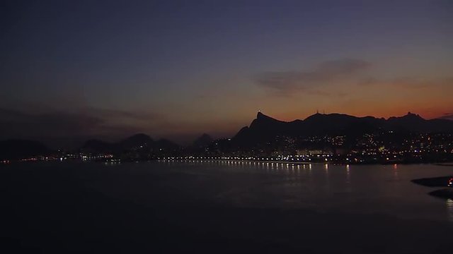 Flying along coast of Rio de Janeiro at Dusk, Brazil