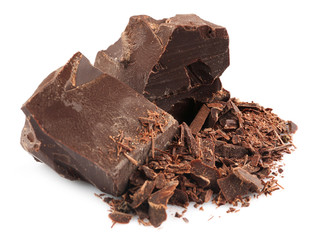 Dark chocolate pieces and shavings isolated on white