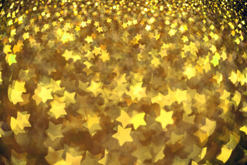 Festive Christmas background with stars. Abstract twinkled brigh