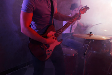 Fototapeta na wymiar Musicians playing musical instruments in a studio