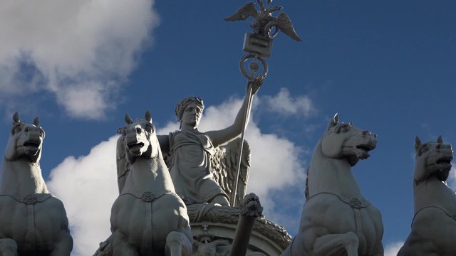 goddess Nike on the triumphal chariot on sky background