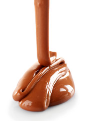 Milky brown chocolate pouring, isolated on white