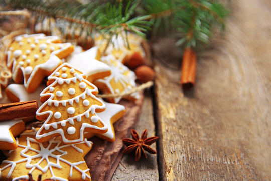 Christmas cookies with spices on wooden table