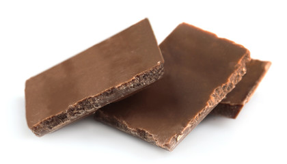 Milk chocolate pieces isolated on white