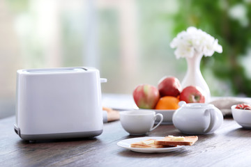 Served table for breakfast with toast and fruit, close-up