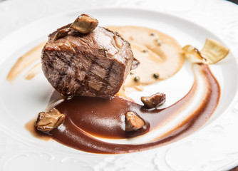 Beef steak with tomato sauce.