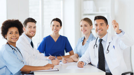 group of happy doctors on conference at hospital