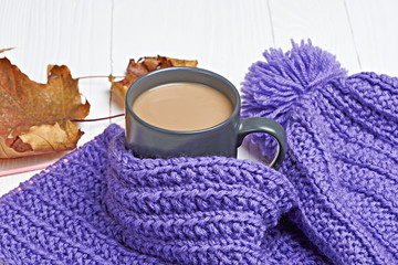 Warm cap, scarf and hot drink