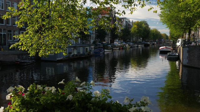 Very pretty static shot of Herengracht Canal at its junction with Brouwersgracht Canal in Amsterdam. Shot in 4K on a sunny morning