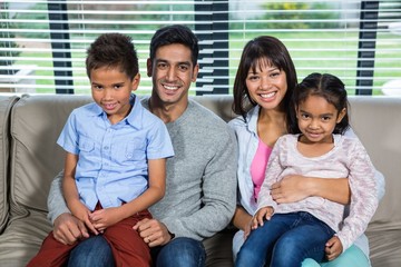 Smiling family on the sofa