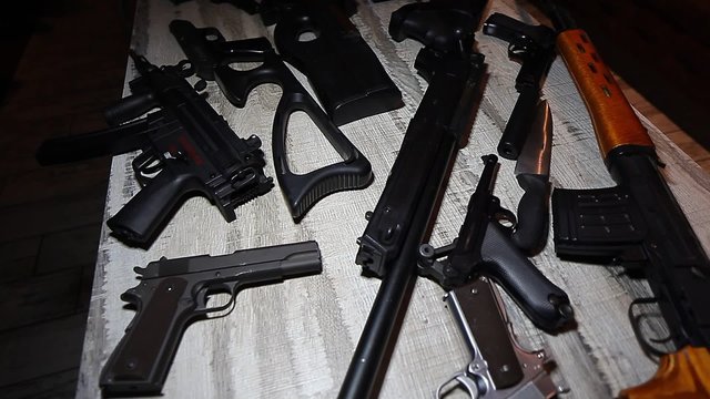 Video Rifles pistols and  guns on the table